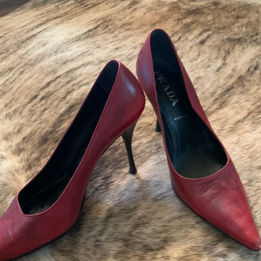 Prada “burnt” red pumps